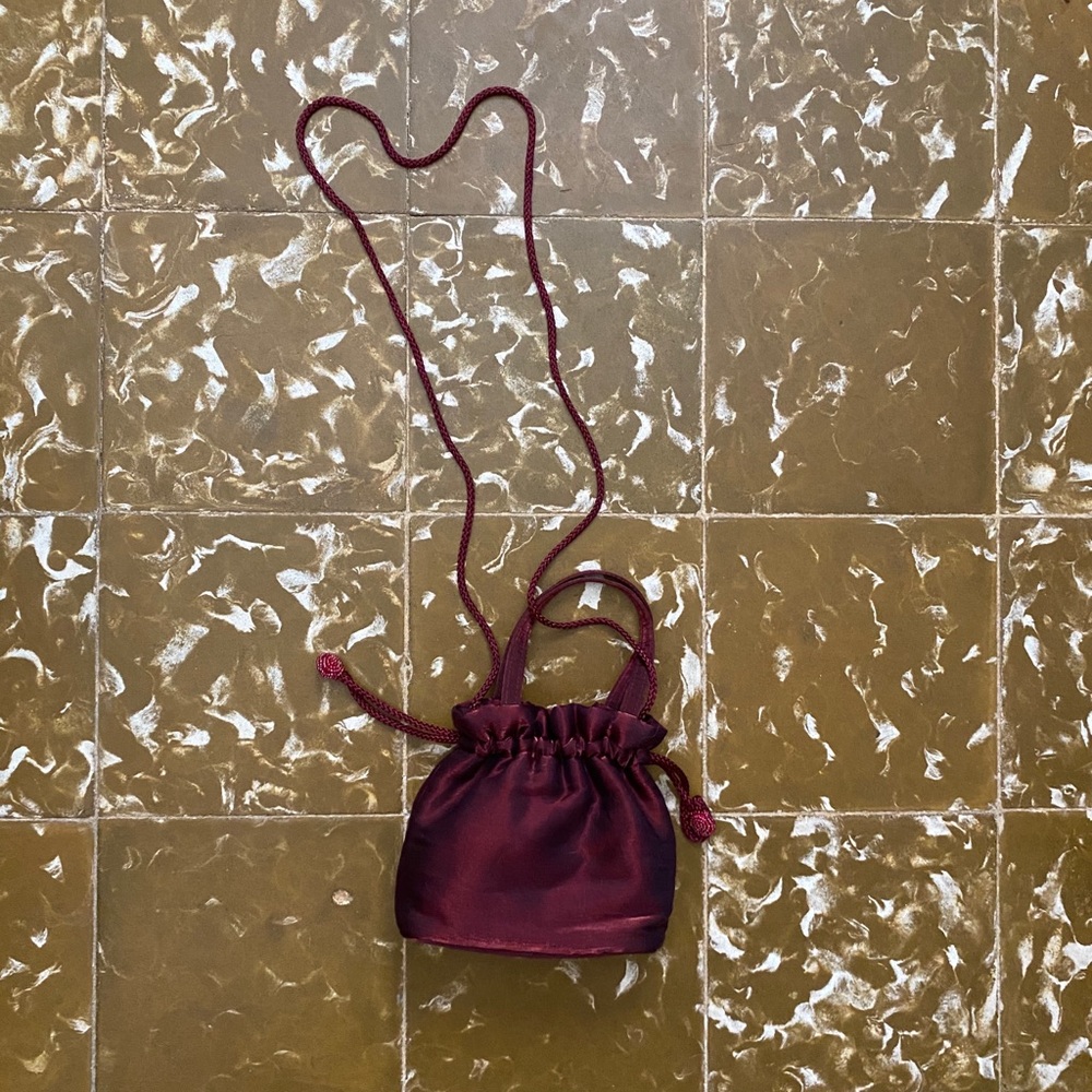 Vintage metallic burgundy drawstring mini bag